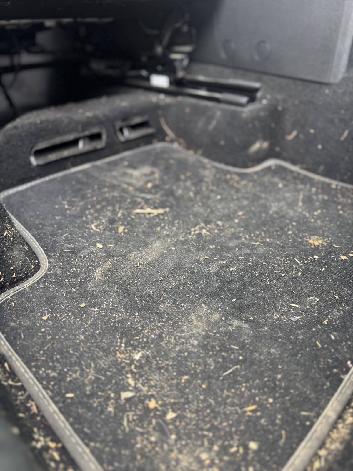Car footwell before cleaning